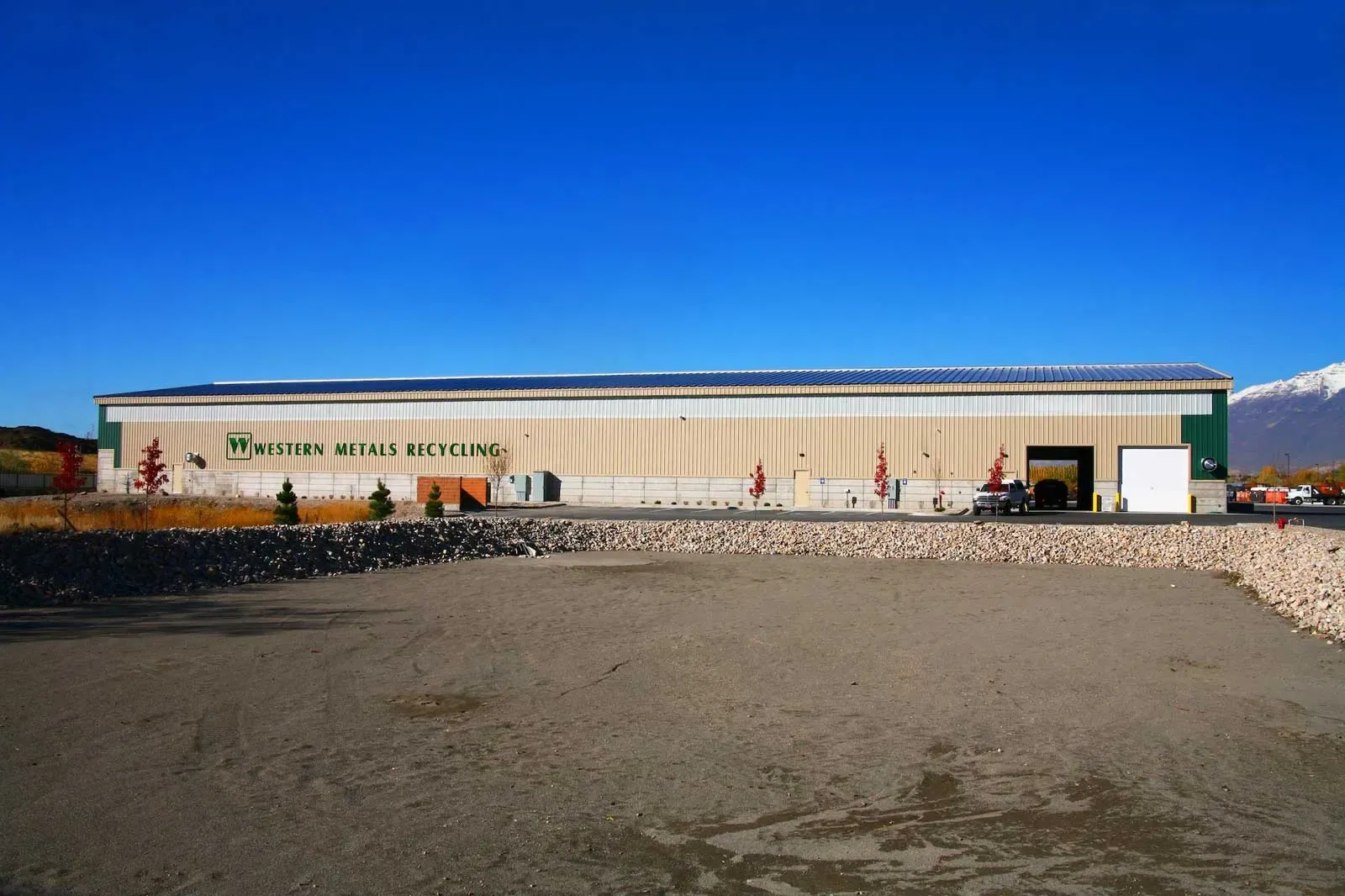 Long tan metal building with Western Metals Recycling lettering across the front.