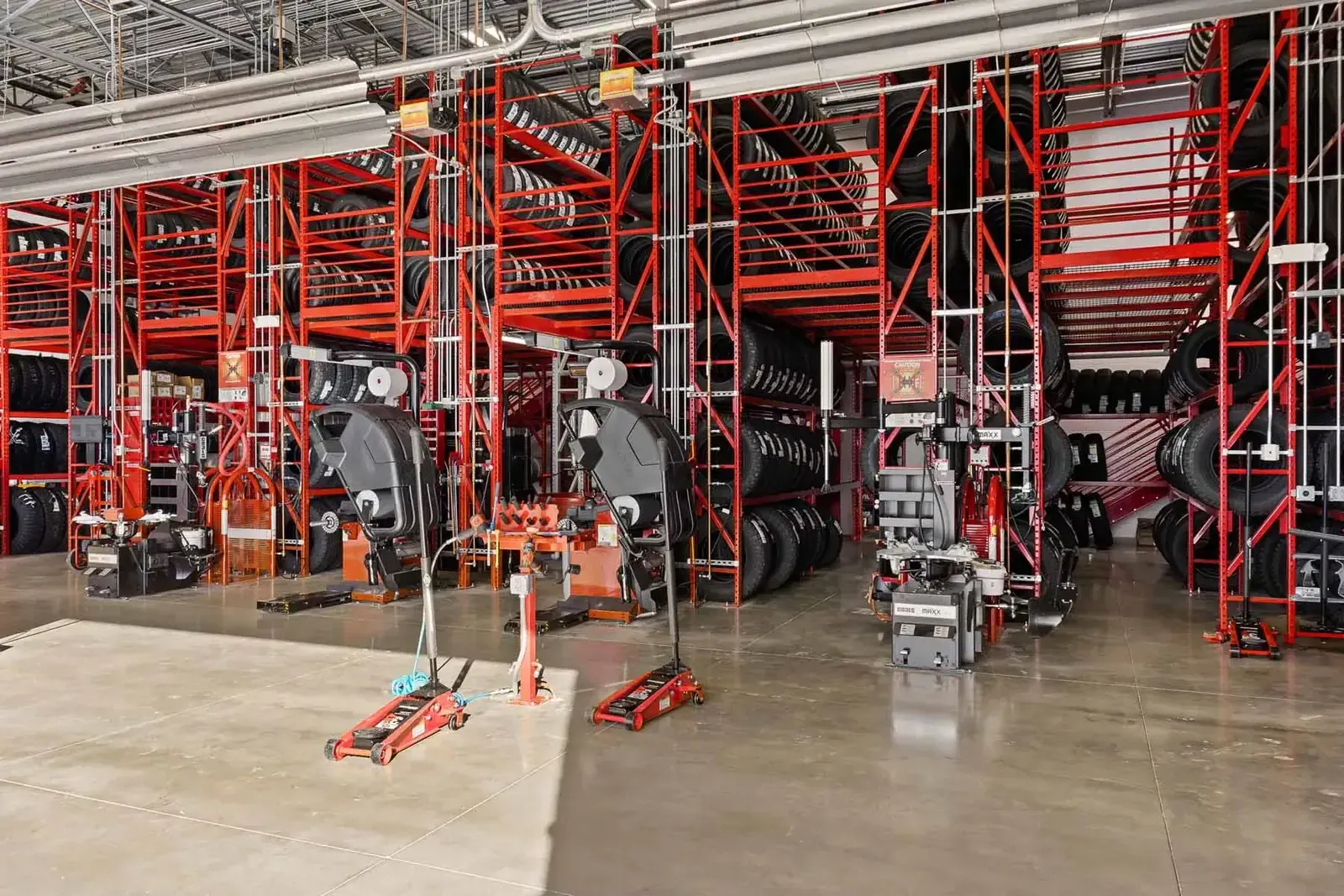 Tire storage racks and tire-changing machines in the service bay