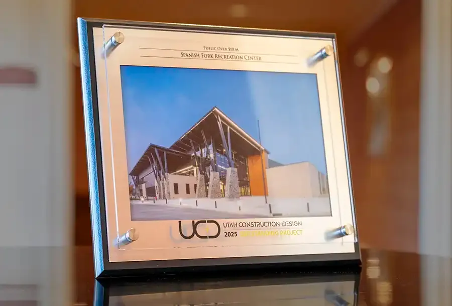 Utah Construction + Design 2025 Outstanding Project plaque for the Spanish Fork Recreation Center, Public Over $10M category